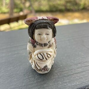 One finely carved Chinese bone netsuke ladies. Signed on the bottom 1”